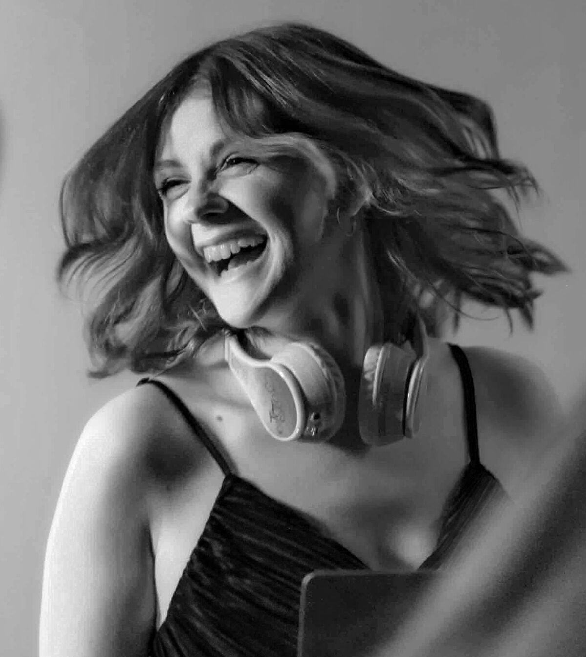 DJ Bayley laughing behind the decks